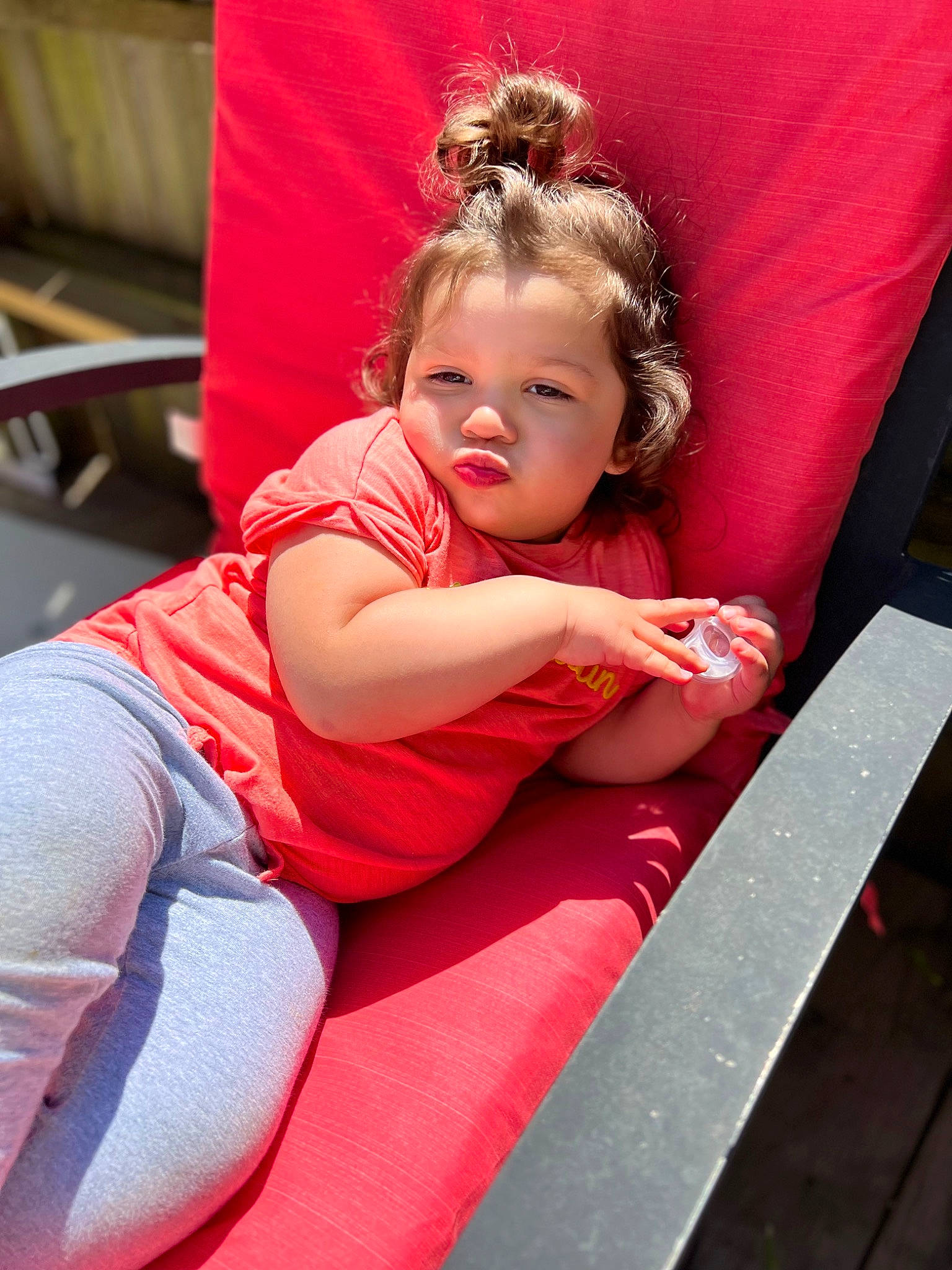 Melody is registered to the contest to win money with this photo: baby_toddler_clothing, blond, brown_hair, child, comfort, fun, happy, human_leg, iris, lap, leg, leisure, long_hair, magenta, person, pink, red, sitting, skin, thigh