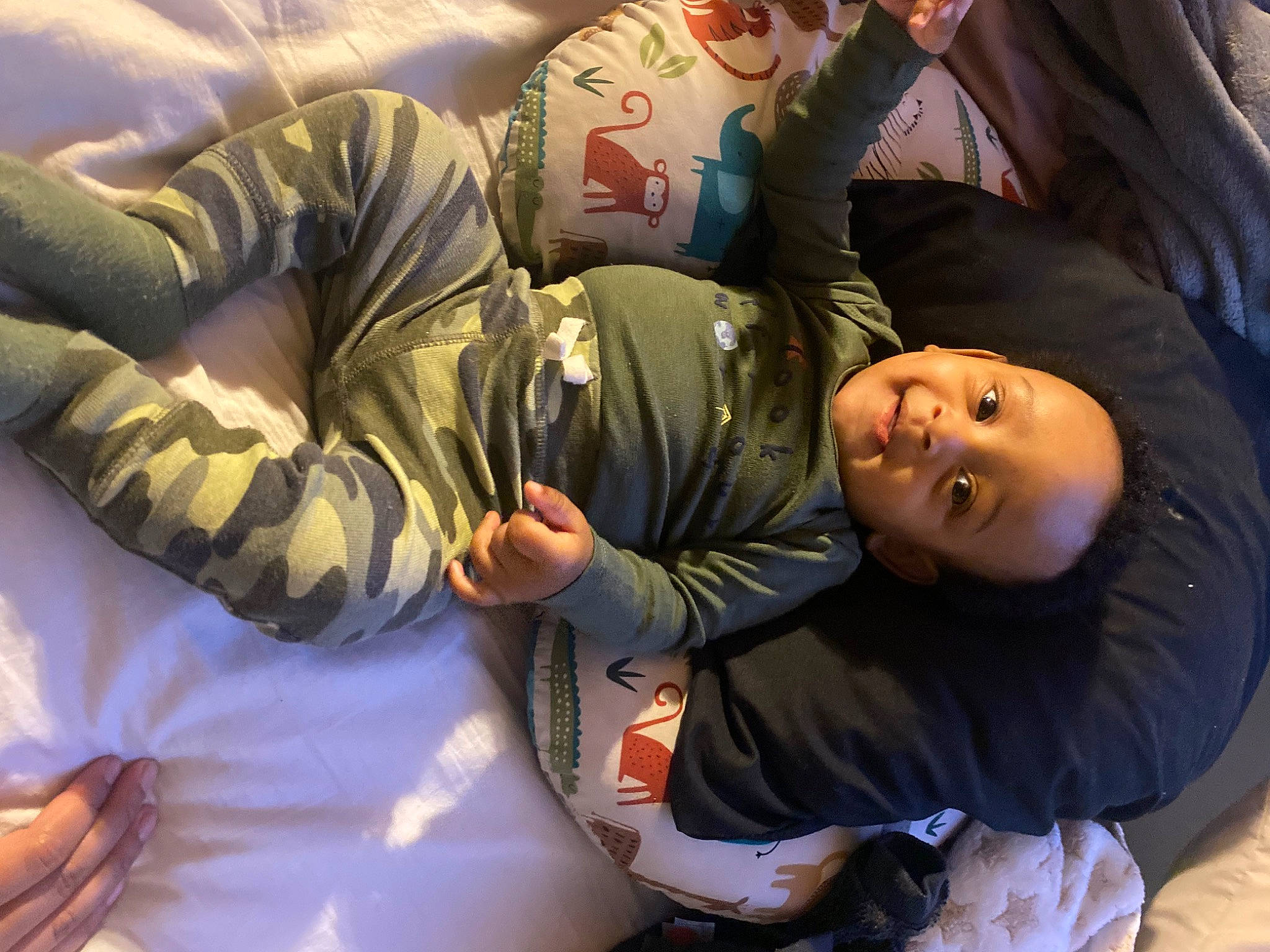 Lenox is registered to the contest to win money with this photo: arm, baby, baby_toddler_clothing, child, comfort, elbow, fun, gesture, happy, jacket, joy, mouth, person, room, sitting, sleep, sleeve, smile, toddler, tree