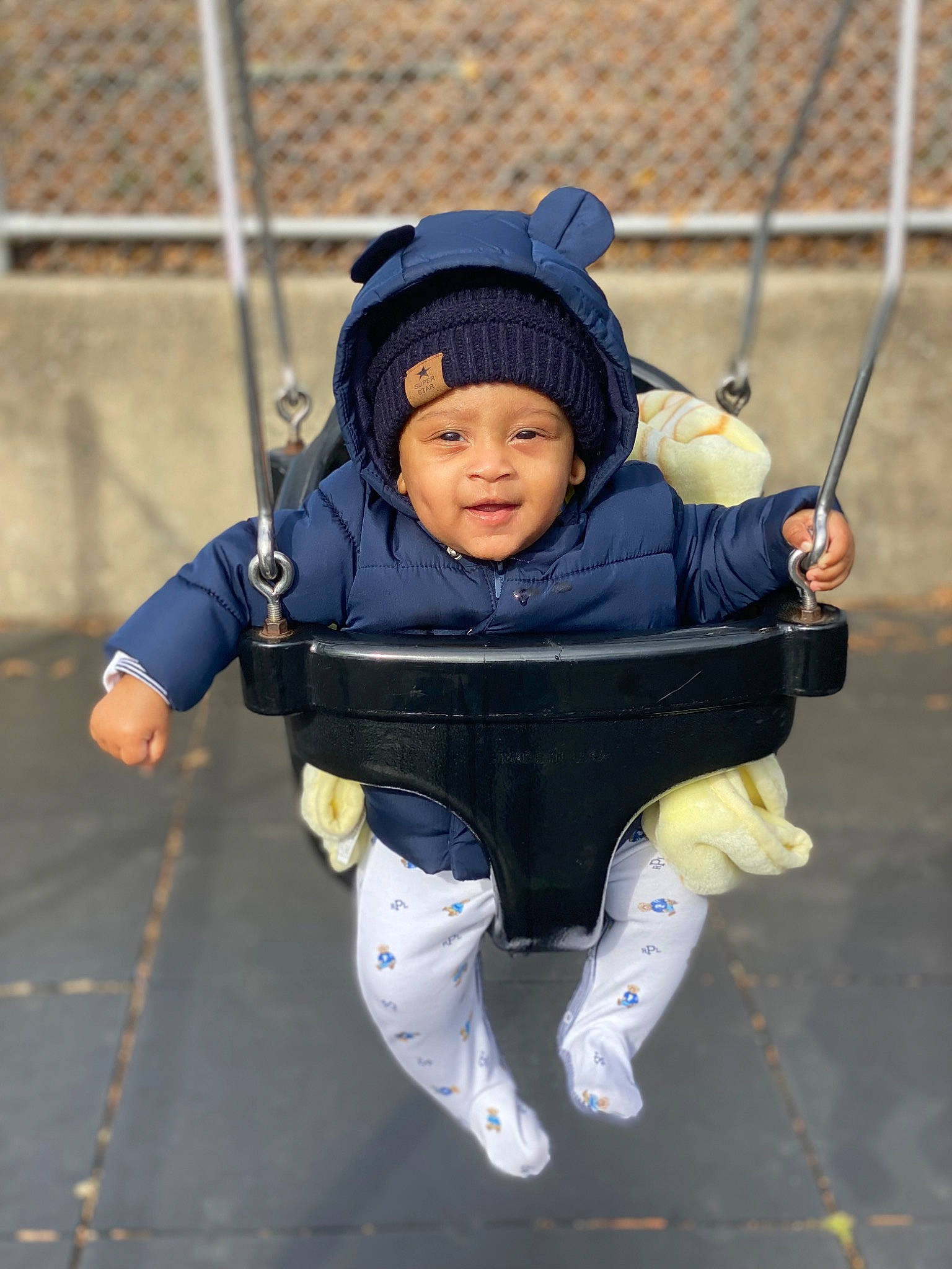 Lenox is registered to the contest to win money with this photo: baby, baby_products, baby_toddler_clothing, child, city, electric_blue, eye, fence, fun, grass, happy, headwear, human_body, leisure, person, play, playground, recreation, smile, swing