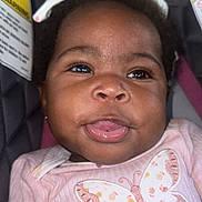 Kylani joined the competition — help win amazing prizes! baby, infant, child, pink_clothing, butterfly, tongue_out, car_seat, warning_label, cute, smiling, hand, headband, portrait, closeup, happy, person, face, skin, young, indoors