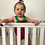 Ryder joined the competition — help win amazing prizes! toddler, child, crib, swimsuit, hair_tie, standing, baby, indoor, nursery, toy, white, railing, person, furniture, wall_art, cute, hair, playful, expression, room