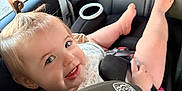 Ryder joined the competition — help win amazing prizes! toddler, child, car_seat, smile, happy, hair_tie, baby, seatbelt, car_interior, window, skin, face, person, foot, clothing, seat, safety, cute, infant, playful