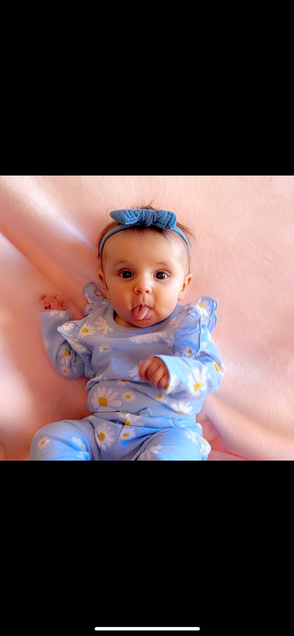 Brynlee is registered to the contest to win money with this photo: abdomen, baby, baby_products, baby_toddler_clothing, cheek, child, electric_blue, eye, eyelash, face, fashion_accessory, flash_photography, happy, head, iris, jewellery, peach, person, portrait_photography, sitting