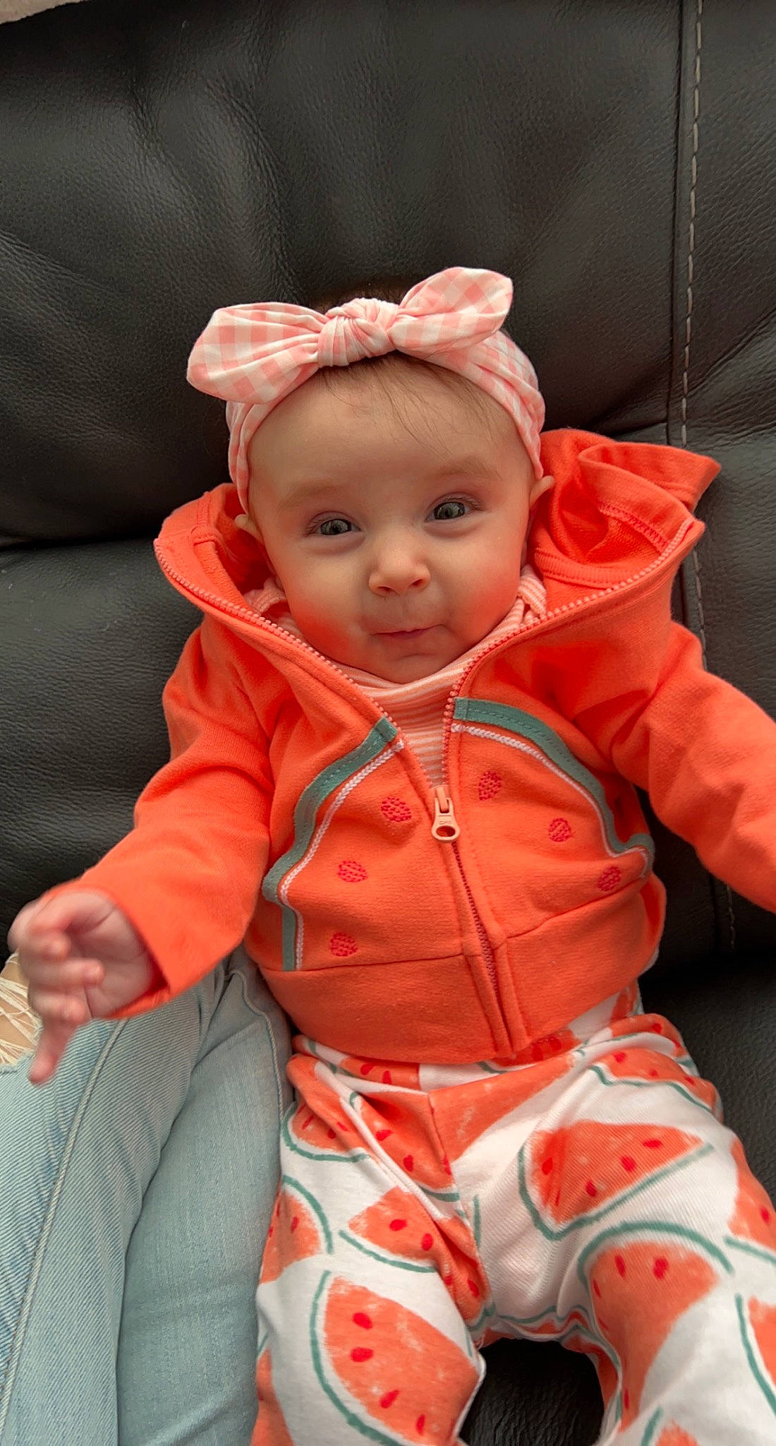 Brynlee is registered to the contest to win money with this photo: baby, baby_products, baby_toddler_clothing, cheek, chin, comfort, eye, head, iris, linens, lip, mouth, nose, orange, outerwear, peach, person, sitting, skin, sleeve