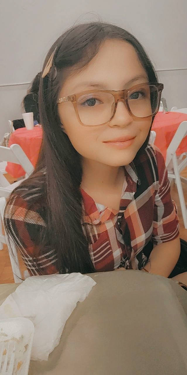 Ingrid joined the competition — help win amazing prizes! bangs, beauty, black_hair, brown_hair, chair, child, chin, eye, eyebrow, eyelash, eyewear, forehead, glasses, hairstyle, joy, lip, long_hair, person, plaid, skin