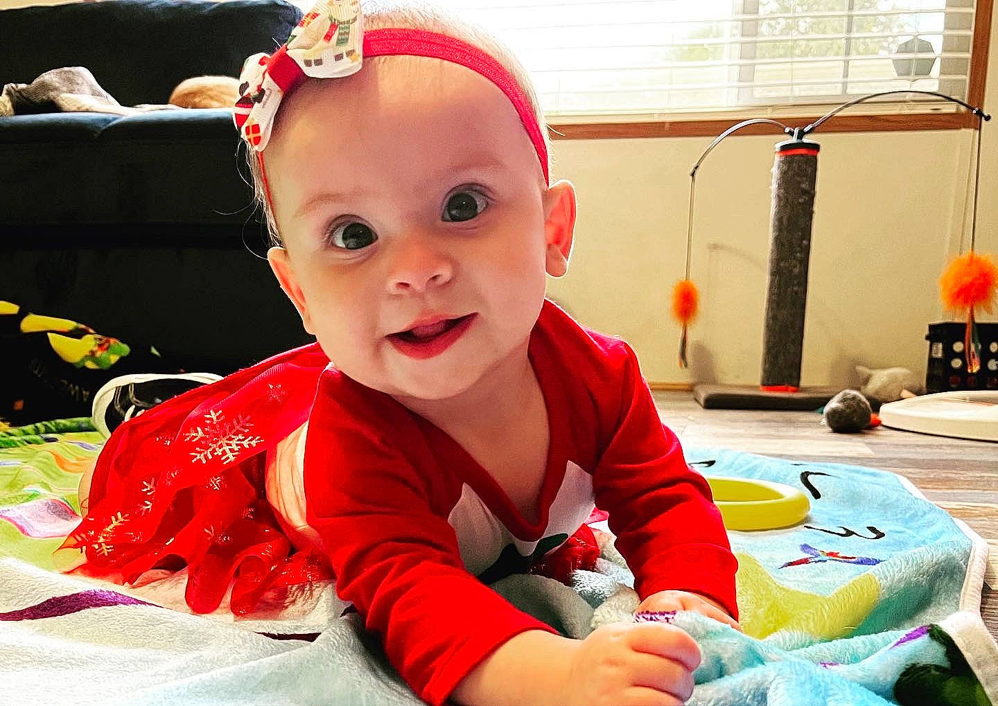 Bexley is registered to the contest to win money with this photo: baby, baby_playing_with_toys, baby_products, baby_toddler_clothing, carmine, child, event, eye, fictional_character, fun, happy, holiday, orange, person, play, room, sitting, smile, toddler, toy