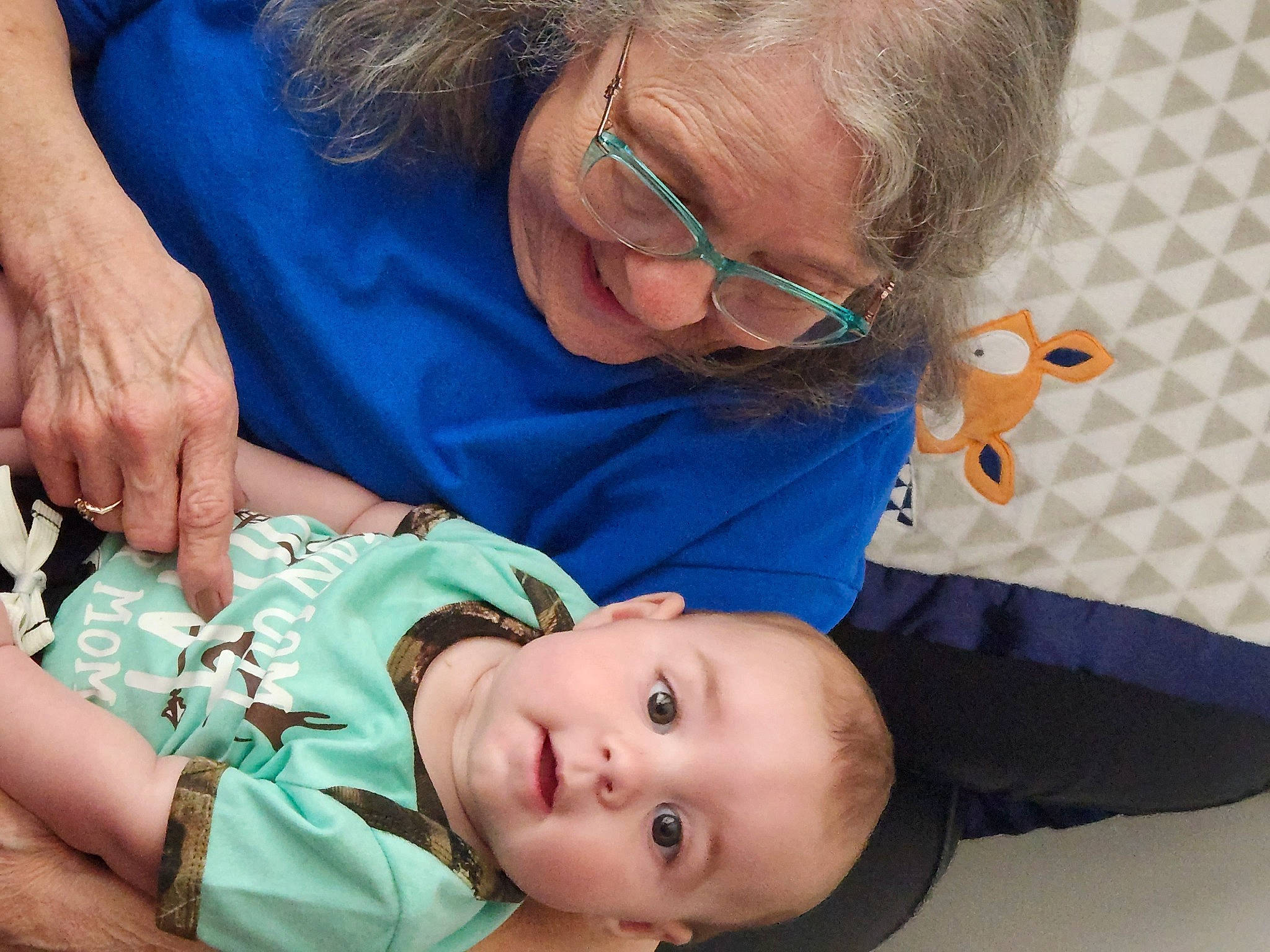 Bradley is registered to the contest to win money with this photo: baby, baby_toddler_clothing, cheek, child, comfort, ear, face, glasses, happy, head, mammal, mouth, nose, people, person, product, room, sitting, skin, toddler
