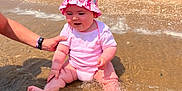 Ninon participe au concours pour gagner de l'argent avec cette photo : adult, baby, beach, child, cute, fun, hand, happy, infant, nature, outdoor, pink_clothing, pink_hat, play, sand, splashing, summer, sunny, vacation, water