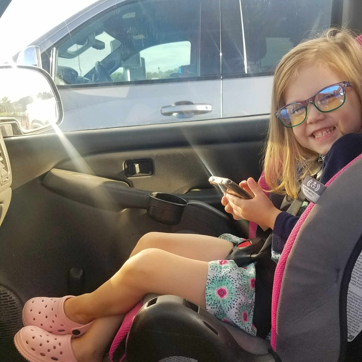 Okleigh Lynd joined the competition — help win amazing prizes! accessories, car, car_interior, carseat, clothing, electronics, face, footwear, head, machine, mobilephone, person, phone, photography, portrait, shoe, sunglasses, transportation, vehicle, wheel