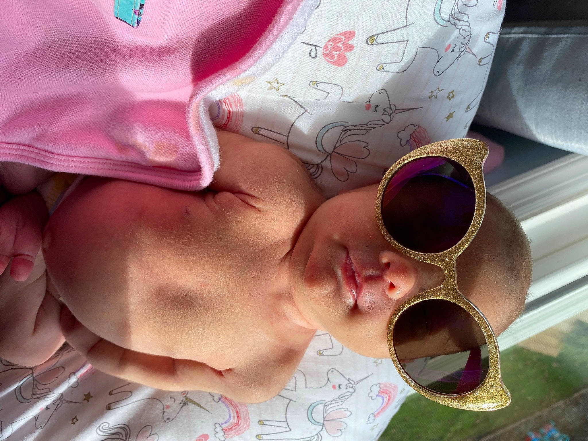 Gia is registered to the contest to win money with this photo: baby, beauty, cheek, child, cool, design, ear, eye, eyewear, glasses, hand, head, mouth, nose, organ, person, pink, skin, sunglasses, toddler