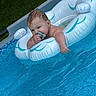 Carson joined the competition — help win amazing prizes! baby, blue, child, cute, floating, grass, infant, inflatable_float, leisure, outdoor, pacifier, pool, relaxing, summer, swimming_pool, vacation, water, wet_hair, white, young_child