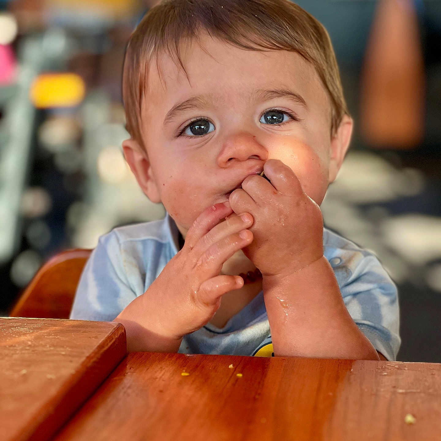 Lucas is registered to the contest to win money with this photo: baby, biting, bodypart, eating, face, finger, food, furniture, hand, happy, hardwood, head, person, photography, plywood, portrait, sad, smile, table, wood