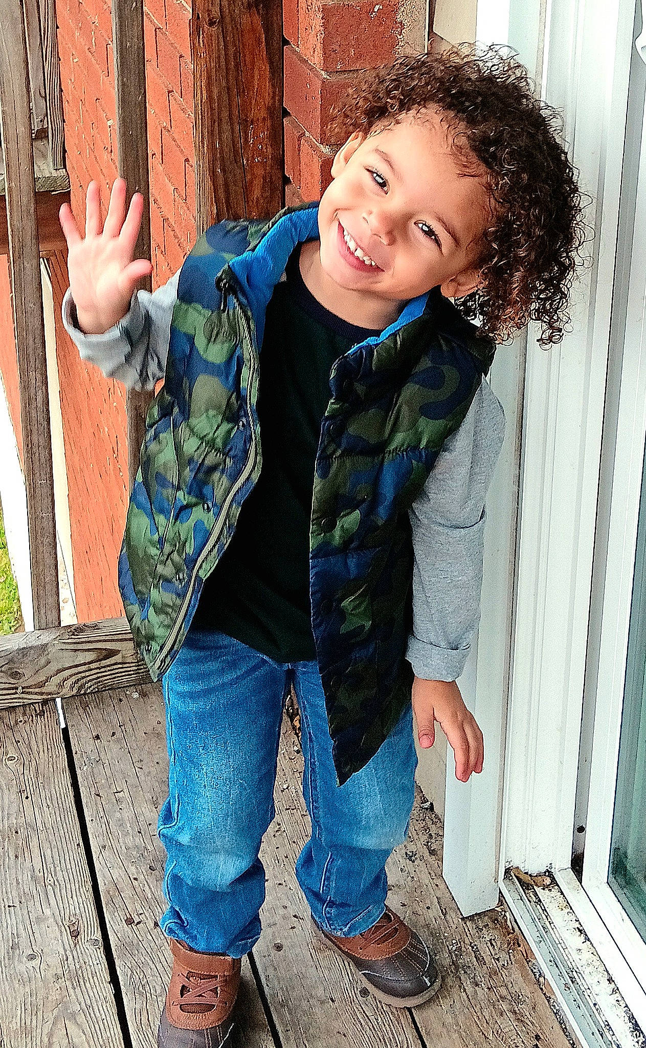 Eli is registered to the contest to win money with this photo: clothing, cool, denim, electric_blue, eye, flash_photography, fun, grass, hair, happy, joy, leg, leisure, person, sitting, sleeve, smile, sneakers, standing, textile