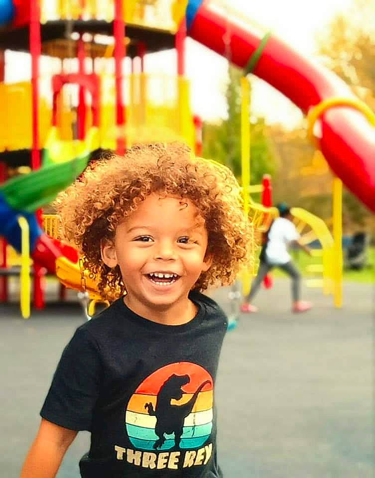 Eli is registered to the contest to win money with this photo: beauty, child, city, facial_expression, fun, happy, human, joy, leisure, organ, people, person, photograph, playground, public_space, recreation, smile, standing, summer, t_shirt