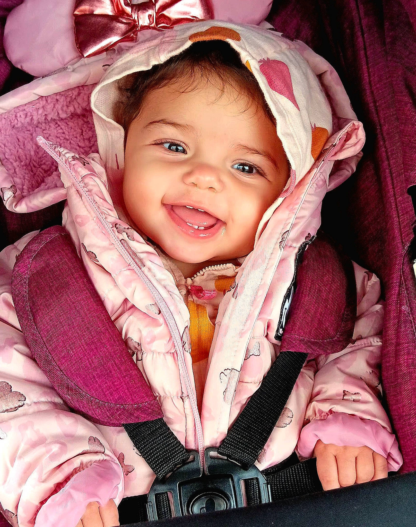 Emerald is registered to the contest to win money with this photo: baby, baby_carriage, baby_products, baby_toddler_clothing, cheek, child, comfort, event, eye, fashion_accessory, flash_photography, fun, happy, head, headwear, iris, magenta, person, pink, sleeve