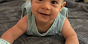 Joseph joined the competition — help win amazing prizes! baby, blanket, child, closeup, clothing, cozy, cute, face, hand, happy, indoors, infant, lying_down, person, portrait, smiling, soft_light, texture, toddler, young