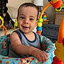 activity_seat, animal, baby, child, colorful, couch, cute, dog, furniture, happy, home, indoor, infant, lamp, living_room, person, playful, portrait, smiling, toy