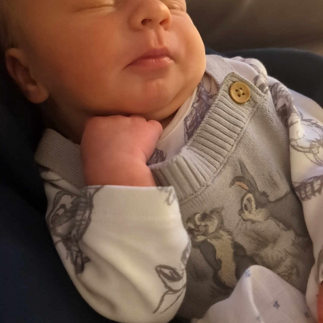 Alfie is registered to the contest to win money with this photo: animal, baby, blanket, bodypart, cat, clothing, cushion, face, finger, hand, head, homedecor, knitwear, newborn, person, pet, photography, portrait, sleeping, sweater