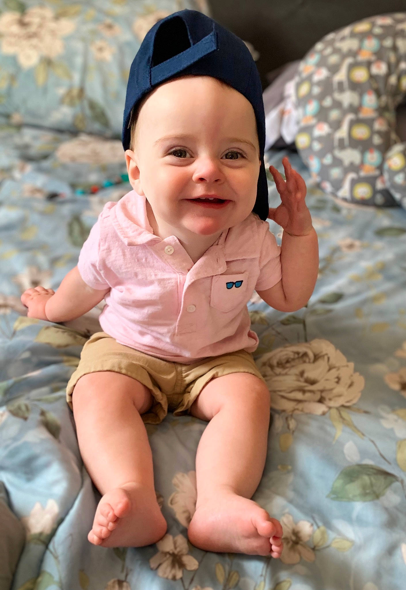 Landon joined the competition — help win amazing prizes! baby, baby_toddler_clothing, baseball_cap, cap, cheek, child, face, fashion_accessory, fun, happy, hat, head, human_leg, joy, pattern, person, pink, sitting, skin, sleeve