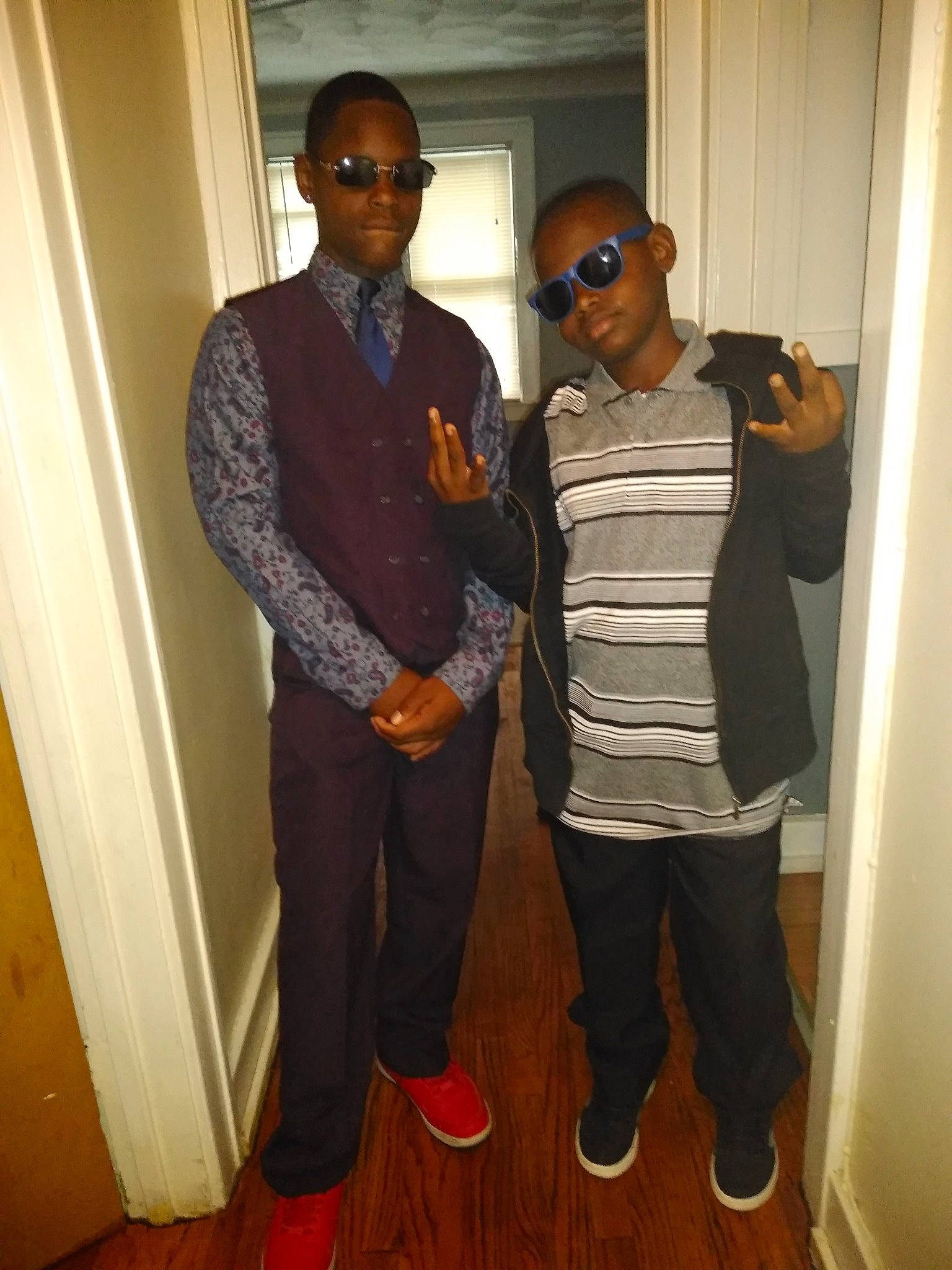 Jericho is registered to the contest to win money with this photo: cool, eyewear, flooring, footwear, formal_wear, fun, gentleman, house, jeans, muscle, outerwear, person, room, shoe, shoulder, standing, suit, vision_care