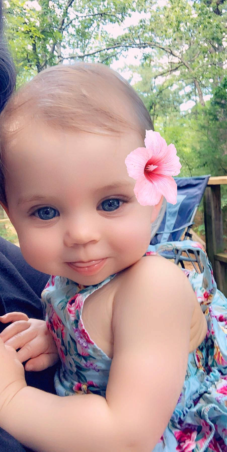 Eliza is registered to the contest to win money with this photo: baby, beauty, cheek, child, ear, eye, face, flower, forehead, hair_accessory, head, lip, nose, person, pink, plant, skin, smile, summer, toddler