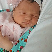 Dana is registered to the contest to win money with this photo: baby, sleeping, headband, flower, blanket, pink, floral, infant, cute, resting, pillow, soft, peaceful, newborn, child, portrait, closeup, indoors, cozy, clothing