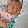 baby, sleeping, headband, flower, blanket, pink, floral, infant, cute, resting, pillow, soft, peaceful, newborn, child, portrait, closeup, indoors, cozy, clothing