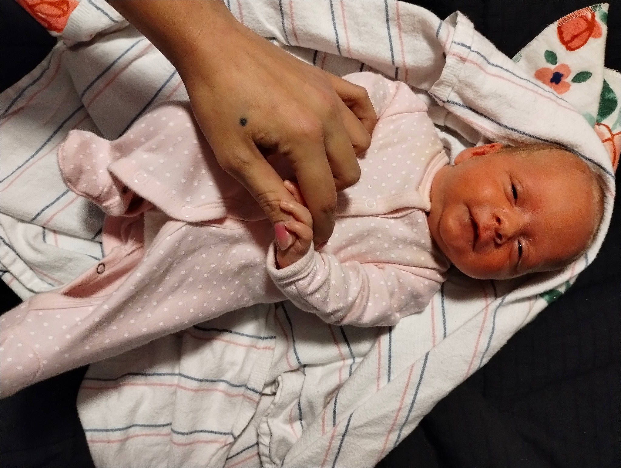 Kyla is registered to the contest to win money with this photo: abdomen, baby, baby_toddler_clothing, bed, child, comfort, elbow, event, finger, gesture, hand, hospital, human_leg, linens, nail, person, room, sleeve, thumb, toddler