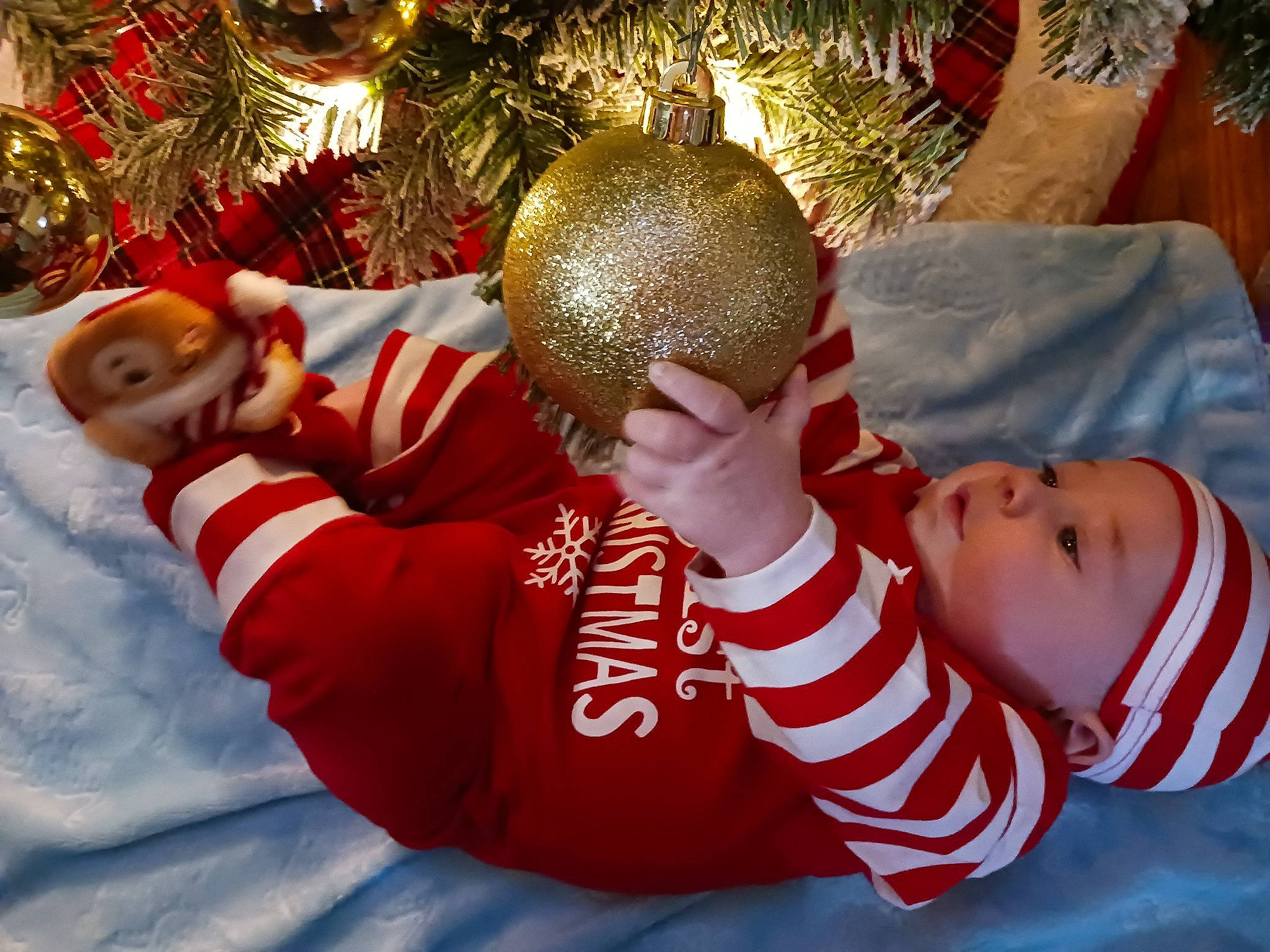 Thomas joined the competition — help win amazing prizes! baby, baby_toddler_clothing, carmine, child, christmas, christmas_decoration, christmas_eve, christmas_ornament, christmas_tree, conifer, event, happy, headwear, holiday, holiday_ornament, ornament, person, plant, sleeve, sock