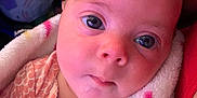 Elena joined the competition — help win amazing prizes! baby, blanket, child, closeup, colorful, cozy, cute, expression, eyes, face, head, infant, newborn, person, pink, portrait, skin, soft, warm, wrapped