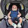 baby, pacifier, car_seat, blue_outfit, socks, curly_hair, infant, child, seatbelt, sitting, indoors, closeup, cute, young_child, person, portrait, chicco, comfortable, wide_eyes, car