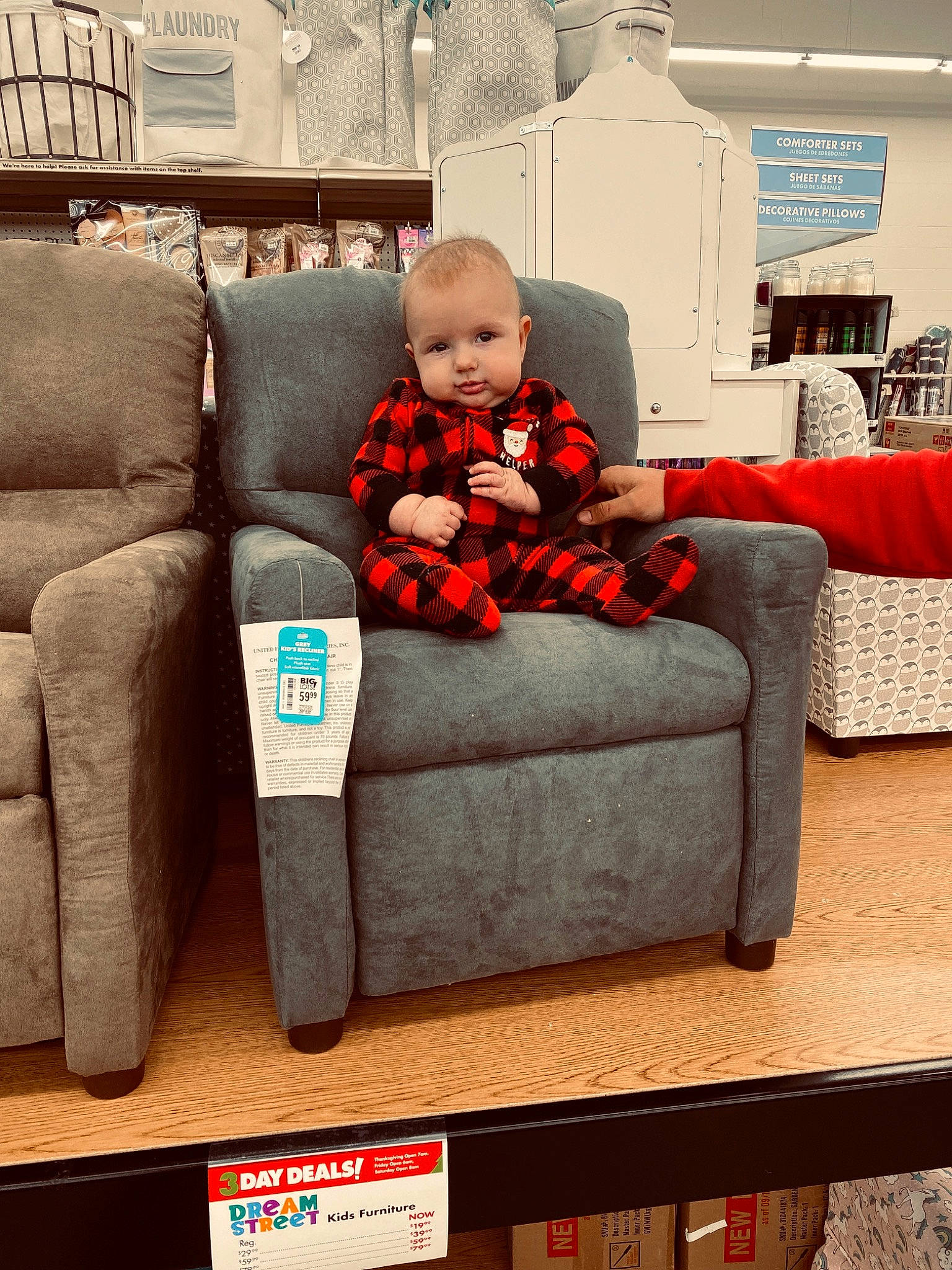 Boone is registered to the contest to win money with this photo: chair, child, christmas, christmas_eve, comfort, couch, furniture, holiday, home, interior_design, living_room, person, play, recliner, red, room, slipcover, toddler