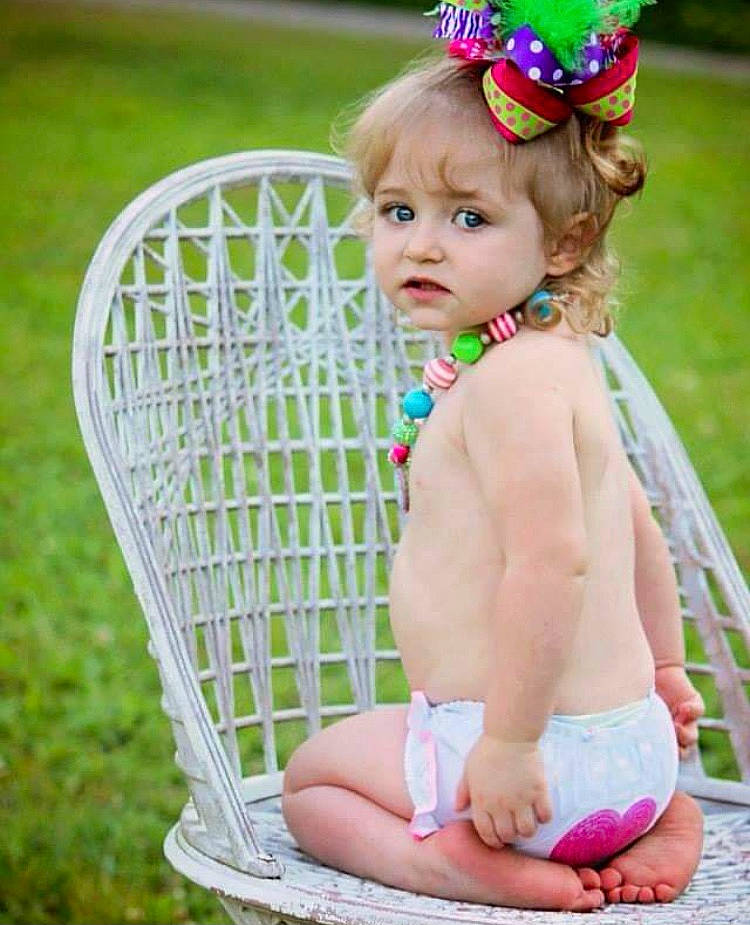 Sam joined the competition — help win amazing prizes! baby, baby_products, baby_toddler_clothing, child, child_model, fashion_accessory, fawn, hair_accessory, headband, headgear, headpiece, pattern, person, photograph, photography, pink, product, sitting, summer, toddler