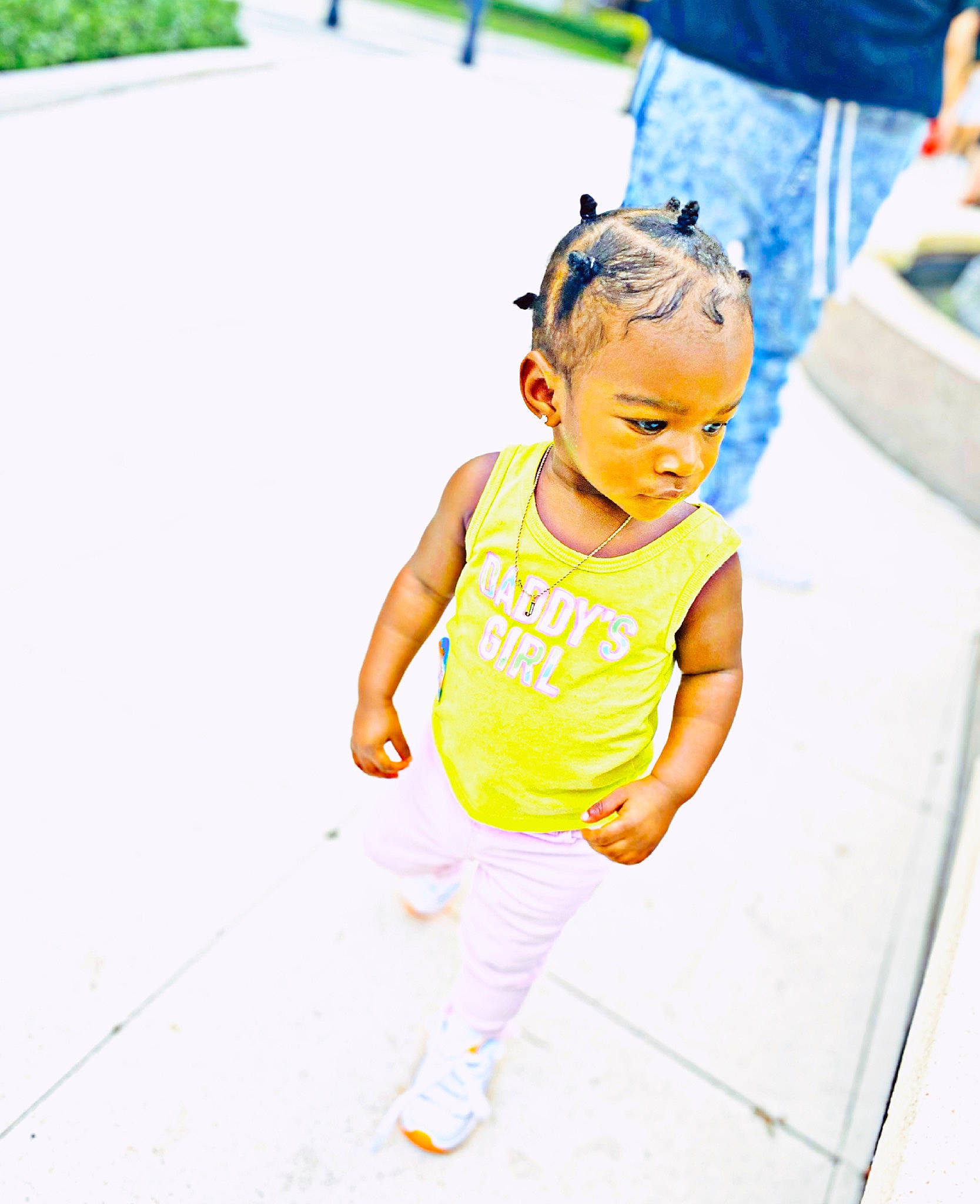 Jazlynn is registered to the contest to win money with this photo: asphalt, baby_toddler_clothing, child, eyewear, facial_expression, fun, grass, green, happy, head, human_leg, leisure, person, public_space, recreation, running, street_fashion, summer, t_shirt, thigh