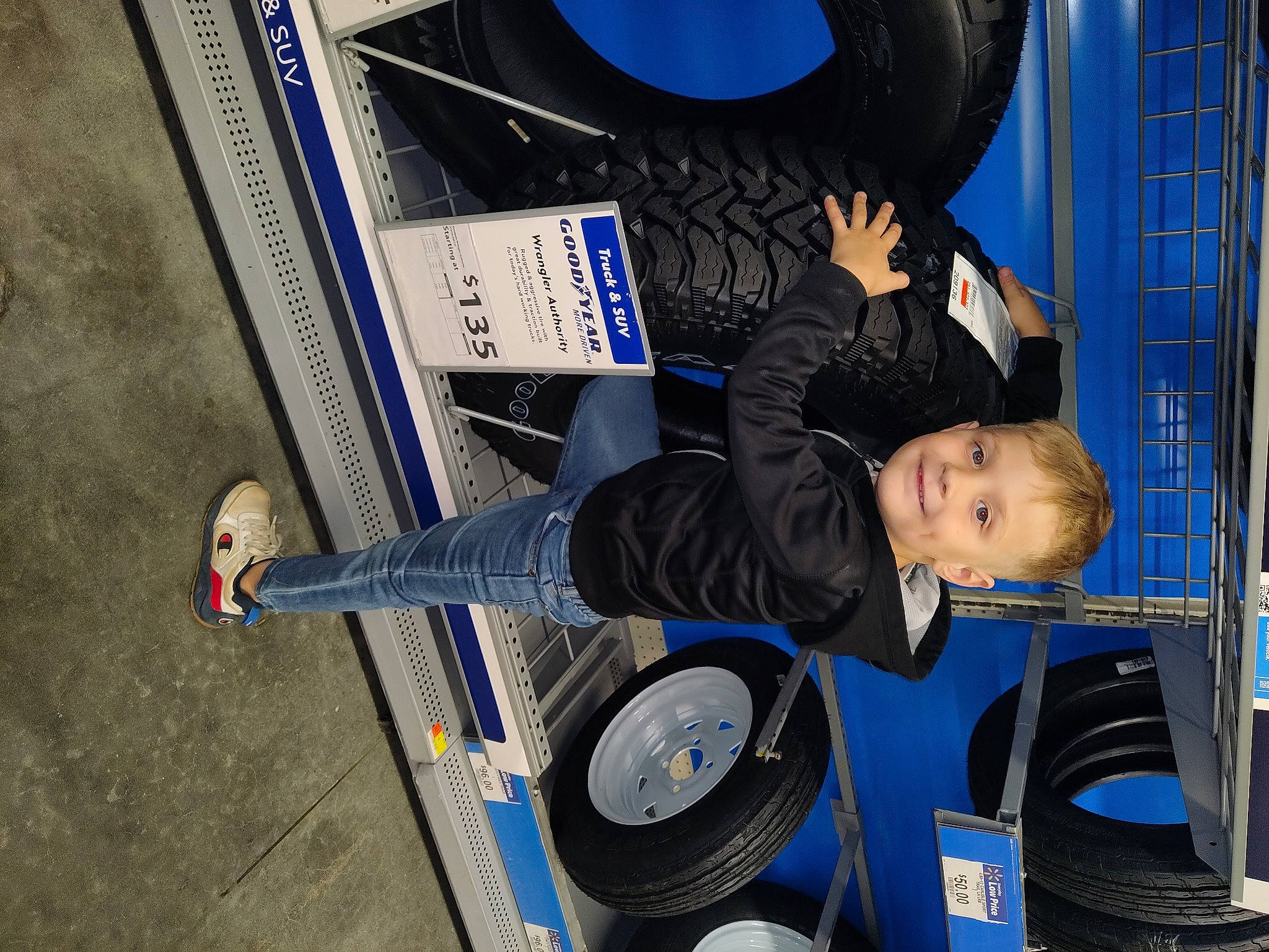 Jackson is registered to the contest to win money with this photo: auto_part, automotive_design, automotive_exterior, automotive_tire, automotive_wheel_system, blue, bumper, electric_blue, fender, gas, joy, motor_vehicle, person, rim, rolling, technology, tire, tread, vehicle, vehicle_door