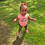 Symphony joined the competition — help win amazing prizes! toddler, child, pink_bows, smiling, outdoor, grass, greenery, sunlight, sneakers, happy, cute, standing, shirt, shorts, shadow, daylight, playful, person, nature, casual