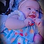 Adelina-Jo is registered to the contest to win money with this photo: baby, baby_girl, blanket, bottle, child, colorful, cute, dress, flower_pattern, hand, happy, headband, indoors, infant, lying_down, playful, portrait, smiling, soft_toys, youth