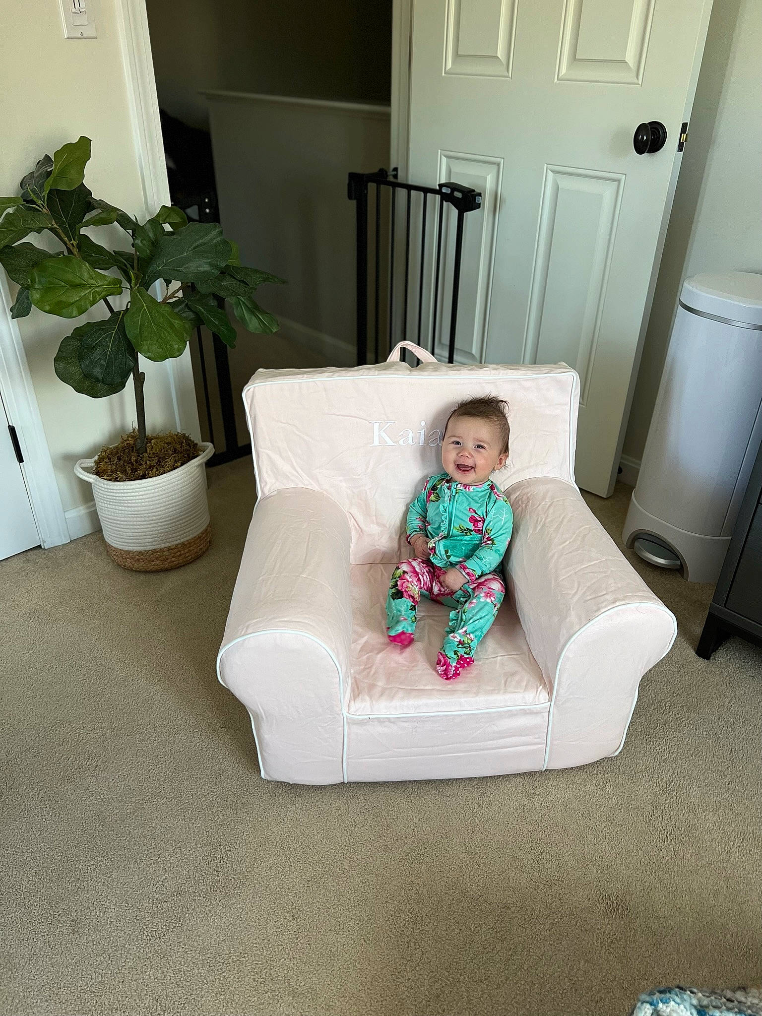 Kaia joined the competition — help win amazing prizes! chair, comfort, couch, door, floor, flooring, flowerpot, hardwood, house, houseplant, interior_design, living_room, person, plant, property, rectangle, room, studio_couch, throw_pillow, toddler