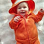 Valentin participe au concours pour gagner de l'argent avec cette photo : baby, baby_clothes, blanket, child, clothing, cute, face, fox_costume, happy, hood, indoor, infant, lying_down, orange_hoodie, person, portrait, smiling, soft_texture, warm_clothes, young_child