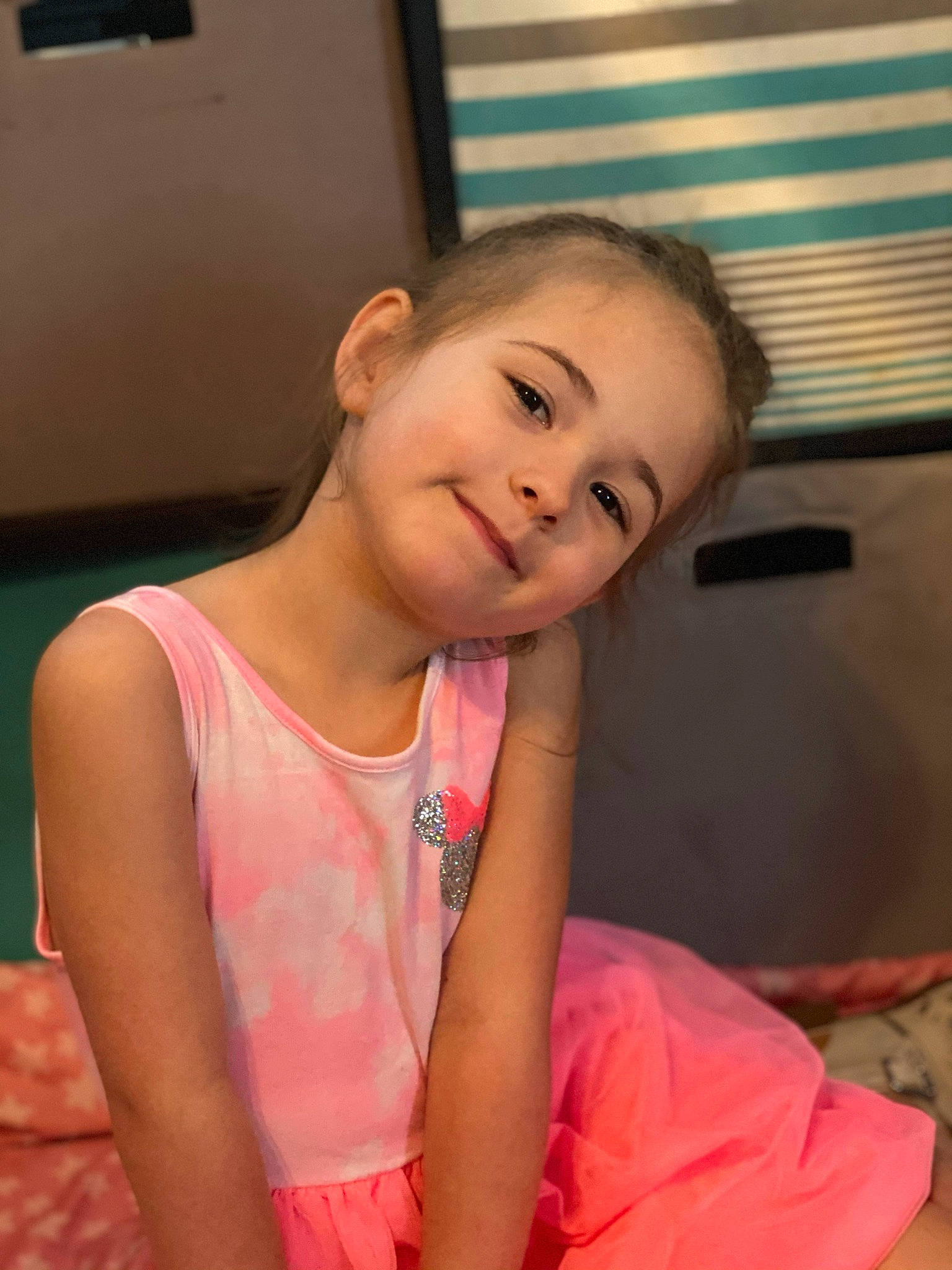 Mackenzie Brooke is registered to the contest to win money with this photo: arm, baby_toddler_clothing, cheek, child, chin, flooring, fun, happy, iris, joy, leisure, mouth, neck, nose, person, room, skin, smile, t_shirt, thumb