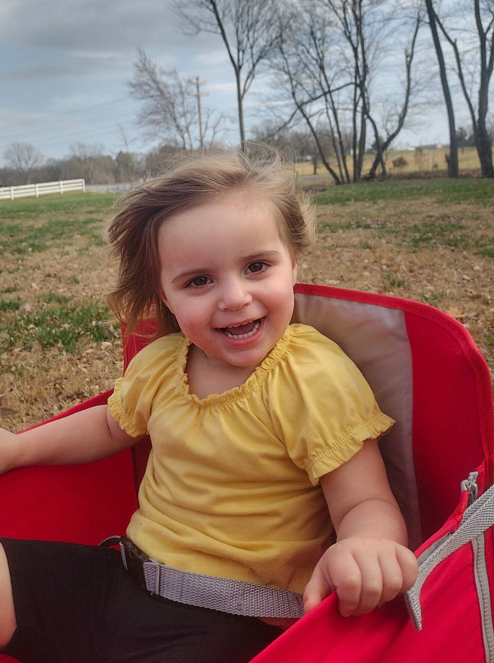 Alaina joined the competition — help win amazing prizes! boats_and_boating_equipment_and_supplies, child, chin, cloud, fun, grass, happy, joy, lap, leisure, outdoor_play_equipment, person, plant, recreation, sitting, skin, sky, smile, summer, t_shirt