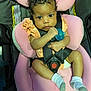 baby, car_safety, car_seat, child, clothing, curly_hair, cute, expression, holding, indoor, infant, looking, pacifier, person, pink, portrait, seat_belt, small_child, socks, straps