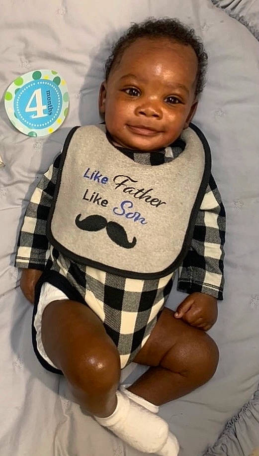 Jayson is registered to the contest to win money with this photo: arm, baby_toddler_clothing, cheek, cool, eye, facial_expression, finger, hairstyle, happy, head, joint, joy, mouth, neck, person, skin, sleeve, smile, textile, toddler