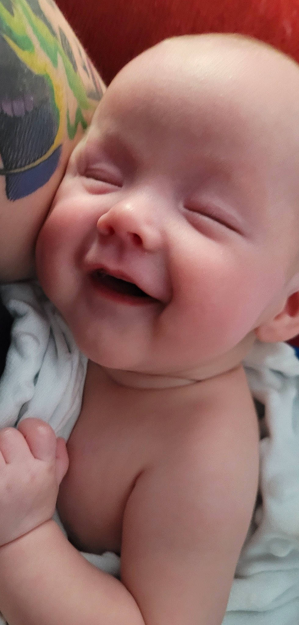 Jakobi is registered to the contest to win money with this photo: baby, cheek, chin, eyebrow, eyelash, finger, gesture, happy, iris, lip, mouth, muscle, neck, nose, person, photograph, pink, skin, smile, thumb