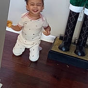 Reneah joined the competition — help win amazing prizes! toddler, child, smiling, pajamas, indoor, wooden_floor, decorative_figure, boots, holiday, kneeling, happy, person, home, wall, floor, toy, cute, small_child, playful, expression