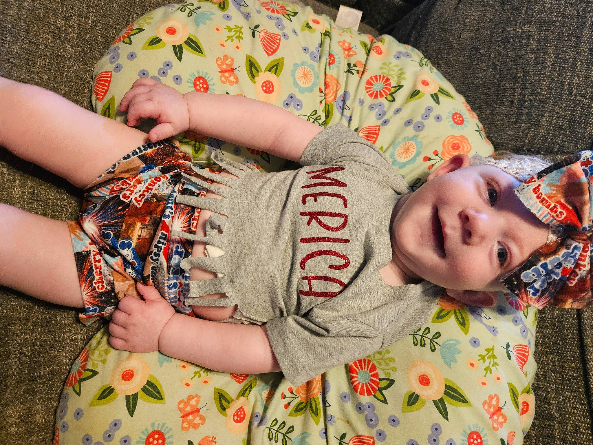 Willa is registered to the contest to win money with this photo: child, comfort, couch, elbow, finger, glasses, hand, happy, human, human_body, joint, neck, pattern, person, skin, sleeve, t_shirt, textile, thigh, toddler