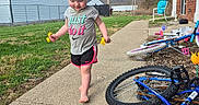 Amethyst joined the competition — help win amazing prizes! barefoot, bicycle, bike, blue_sky, brick_wall, chair, child, curly_hair, daytime, flowers, grass, house, outdoor, play, power_lines, shorts, sidewalk, summer, toddler, tshirt