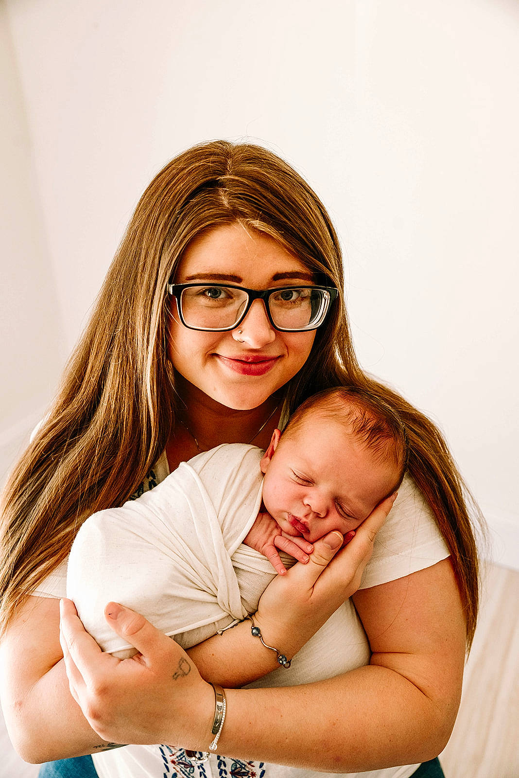 Lawrence is registered to the contest to win money with this photo: arm, baby, comfort, eye, face, finger, flash_photography, gesture, glasses, hair, hand, happy, head, joy, people_in_nature, person, playing_with_kids, shoulder, skin, smile