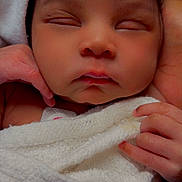 Ty'Lynn is registered to the contest to win money with this photo: baby, sleeping, towel, hands, face, peaceful, newborn, skin, closeup, infant, soft, wrapped, cute, gentle, rest, child, portrait, human, warm, calm