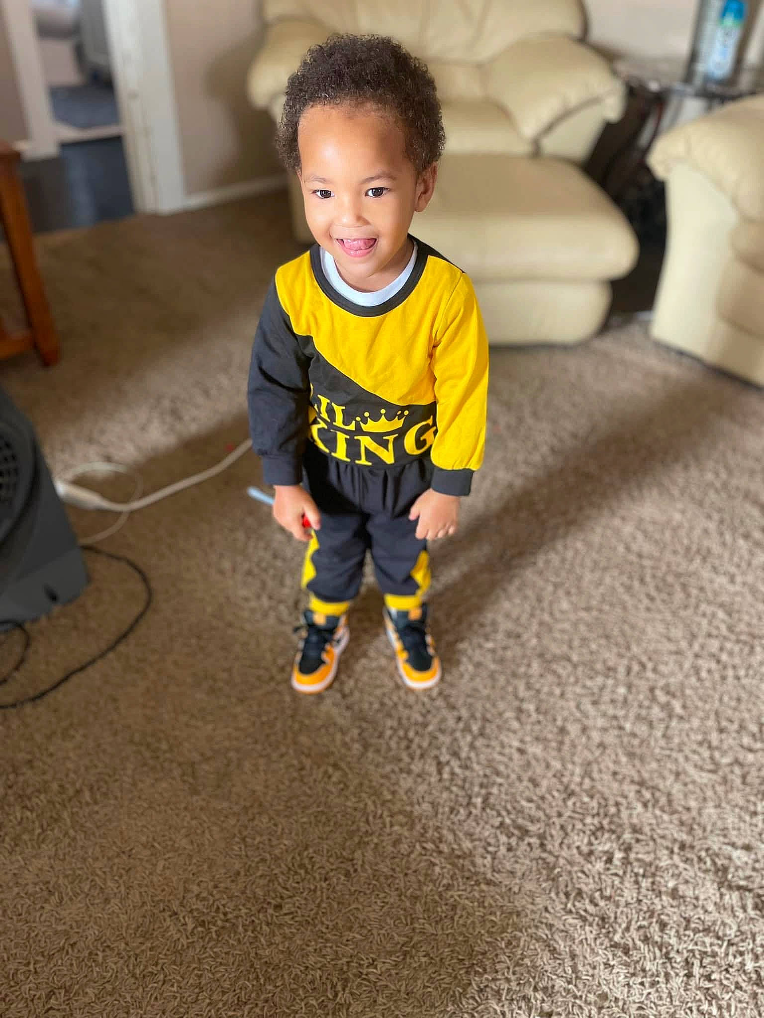 Eli joined the competition — help win amazing prizes! baby, baby_toddler_clothing, carpet, chair, child, comfort, couch, face, floor, flooring, fun, happy, hardwood, head, joy, person, sitting, sleeve, smile, t_shirt